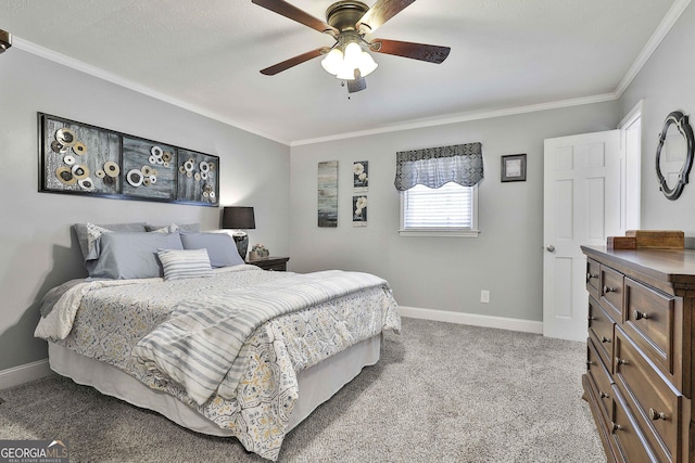 bedroom with a ceiling fan, baseboards, crown molding, and light colored carpet