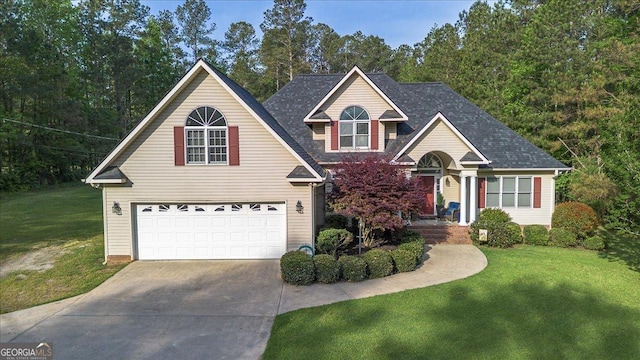 traditional-style home featuring concrete driveway and a front lawn