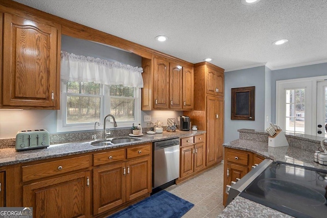 kitchen with stainless steel dishwasher, a textured ceiling, a sink, and brown cabinets