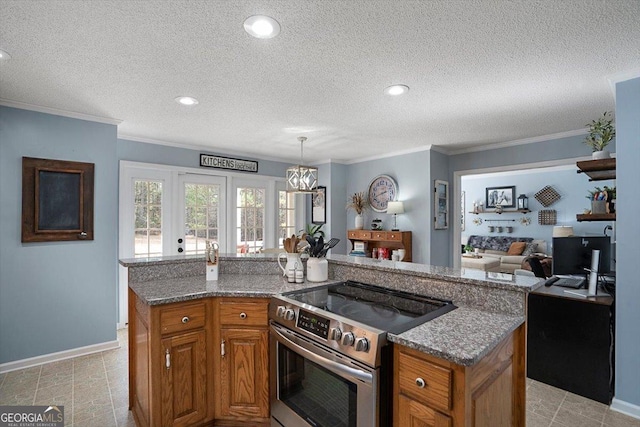 kitchen featuring stone countertops, stainless steel range with electric stovetop, open floor plan, and brown cabinets