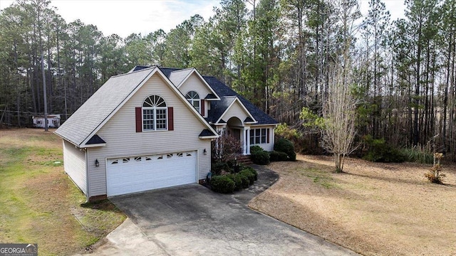 view of front of home with an attached garage and concrete driveway