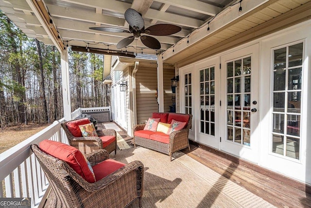 wooden deck with ceiling fan, french doors, and an outdoor hangout area
