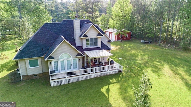 rear view of property with crawl space, a yard, a chimney, roof with shingles, and french doors