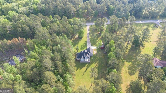 drone / aerial view featuring a forest view
