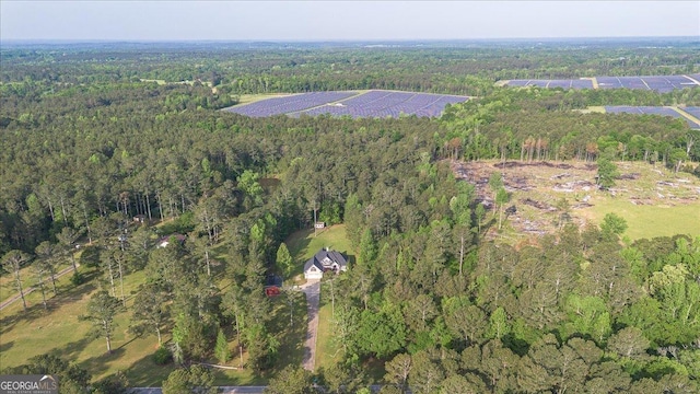 drone / aerial view featuring a view of trees