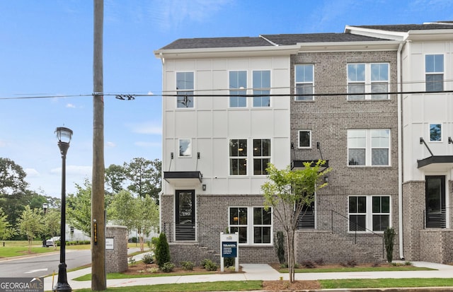 multi unit property featuring brick siding