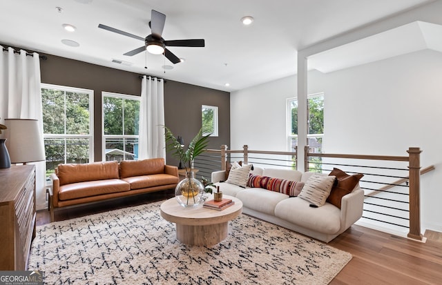 living room featuring wood finished floors, ceiling fan, baseboards, and recessed lighting