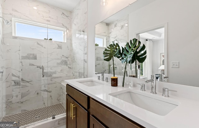full bath featuring a shower stall, plenty of natural light, and double vanity