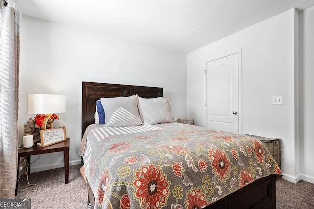 bedroom with carpet flooring and baseboards