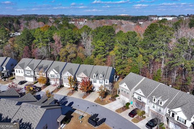 bird's eye view with a forest view and a residential view