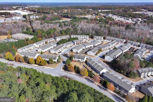 aerial view with a wooded view and a residential view