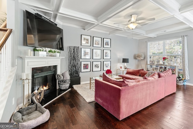 living area featuring dark wood-type flooring, a high end fireplace, beam ceiling, and coffered ceiling