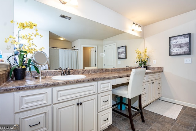 full bathroom featuring baseboards, visible vents, and vanity