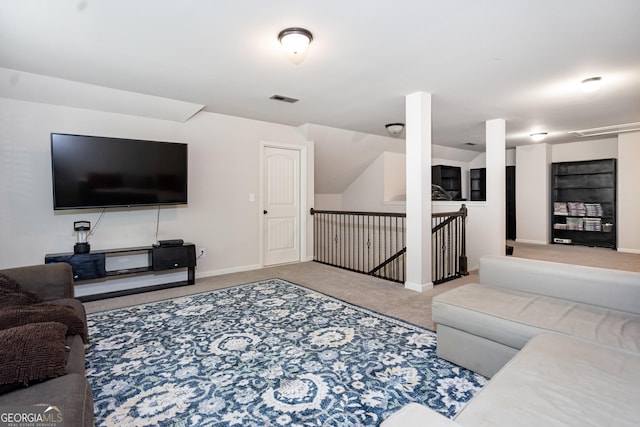 carpeted living room with baseboards and visible vents