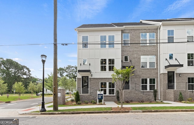 multi unit property featuring brick siding