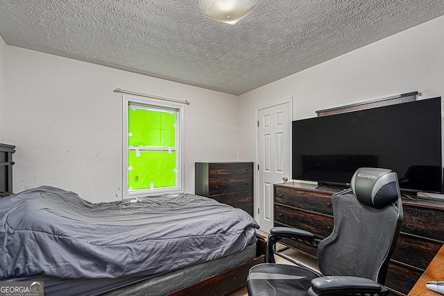 bedroom featuring a textured ceiling