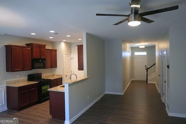 kitchen featuring recessed lighting, dark wood-style flooring, baseboards, light countertops, and black appliances