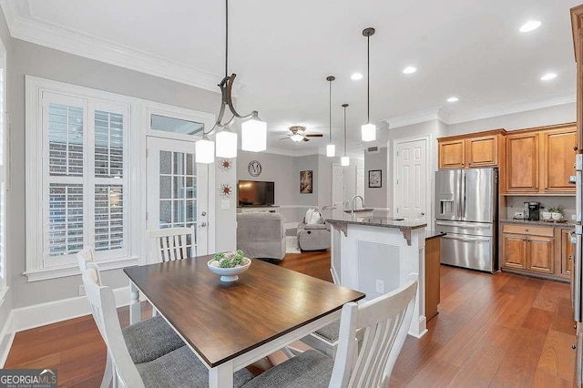 7524 Portbury Park Ln, Suwanee, GA 30024 - dining room featuring dark wood-style floors, ceiling fan, ornamental molding, and baseboards
