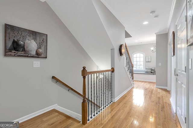 7524 Portbury Park Ln, Suwanee, GA 30024 - hall with ornamental molding, an upstairs landing, light wood-style flooring, and baseboards