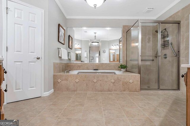 7524 Portbury Park Ln, Suwanee, GA 30024 - bathroom with visible vents, ornamental molding, tile patterned floors, a garden tub, and a shower stall