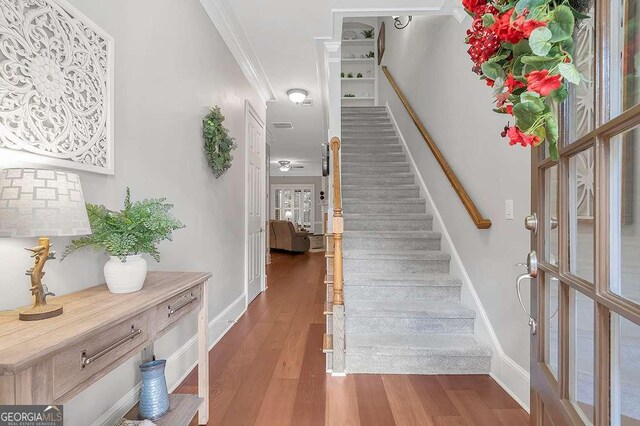 7524 Portbury Park Ln, Suwanee, GA 30024 - stairway with ornamental molding, wood finished floors, and baseboards
