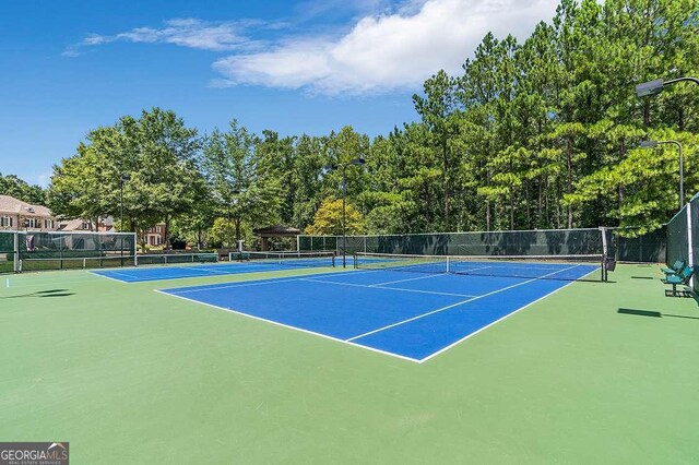 7524 Portbury Park Ln, Suwanee, GA 30024 - view of tennis court featuring fence