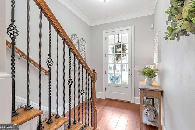 7524 Portbury Park Ln, Suwanee, GA 30024 - entryway featuring stairs, light wood-style floors, baseboards, and crown molding