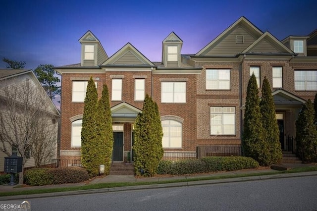 view of property with brick siding