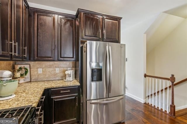 7420 Glisten Ave, Sandy Springs, GA 30328 - kitchen with baseboards, dark wood finished floors, decorative backsplash, light stone counters, and stainless steel refrigerator with ice dispenser