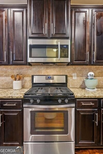 7420 Glisten Ave, Sandy Springs, GA 30328 - kitchen with stainless steel appliances and dark brown cabinets
