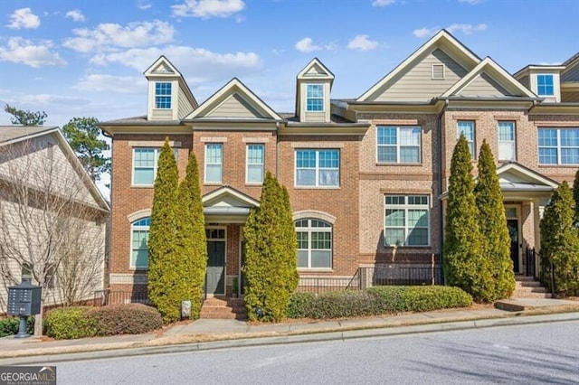 view of property featuring brick siding