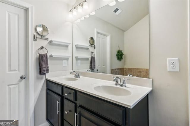 7420 Glisten Ave, Sandy Springs, GA 30328 - full bathroom with double vanity, visible vents, and a sink