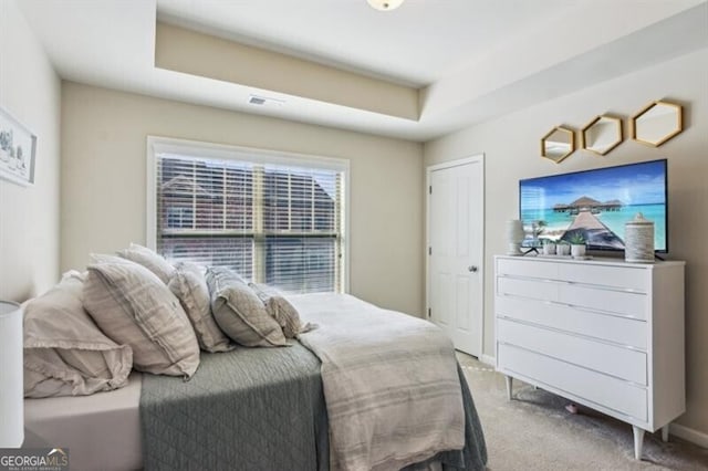 7420 Glisten Ave, Sandy Springs, GA 30328 - bedroom with baseboards, a tray ceiling, and light colored carpet
