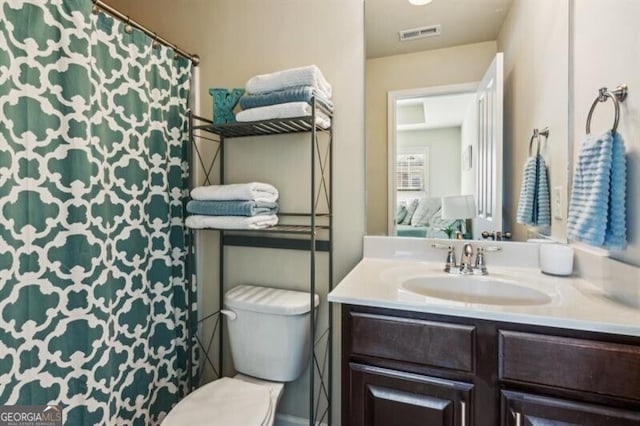 7420 Glisten Ave, Sandy Springs, GA 30328 - bathroom with visible vents, vanity, and toilet