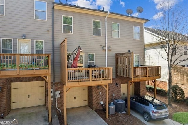 7420 Glisten Ave, Sandy Springs, GA 30328 - back of property featuring a garage, driveway, and brick siding