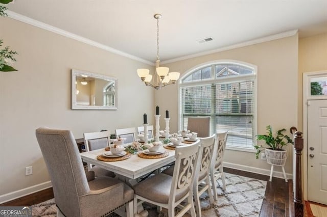 7420 Glisten Ave, Sandy Springs, GA 30328 - dining space featuring ornamental molding, dark wood finished floors, and baseboards