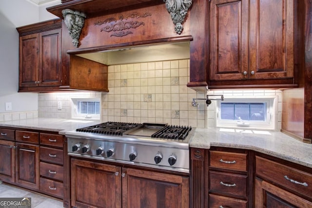 8910 Champion Ct, Ball Ground, GA 30107 - kitchen with decorative backsplash, light stone counters, and stainless steel gas cooktop