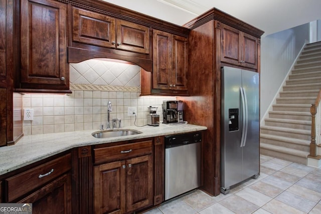 8910 Champion Ct, Ball Ground, GA 30107 - kitchen with stainless steel appliances, a sink, backsplash, light stone counters, and light tile patterned floors