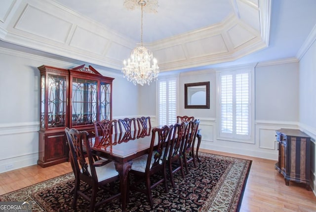 8910 Champion Ct, Ball Ground, GA 30107 - dining area with a chandelier, ornamental molding, wainscoting, light wood-type flooring, and a decorative wall