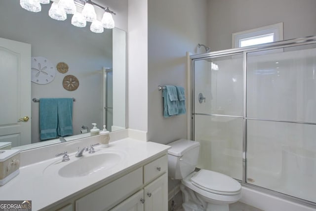 8910 Champion Ct, Ball Ground, GA 30107 - full bathroom featuring a shower stall, vanity, and toilet