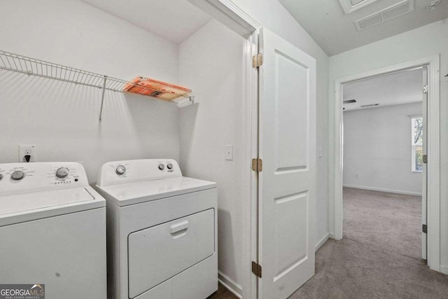 laundry area with laundry area, carpet floors, visible vents, baseboards, and independent washer and dryer