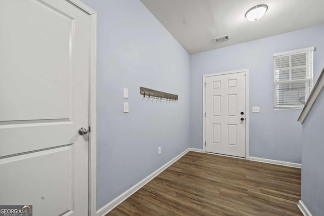 entrance foyer with visible vents, baseboards, and dark wood-style flooring