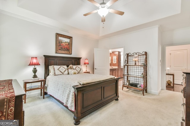 bedroom with light carpet, baseboards, connected bathroom, and crown molding