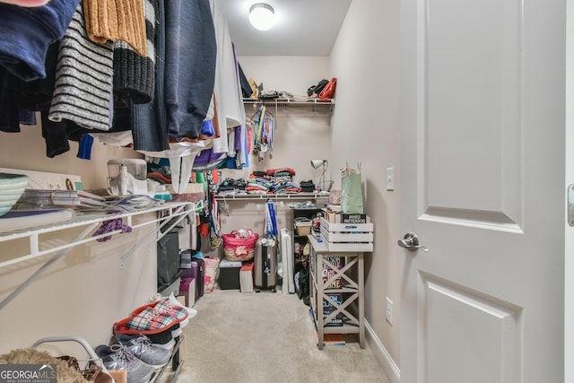 walk in closet featuring carpet