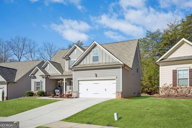 craftsman-style home featuring board and batten siding, a front yard, driveway, and a porch