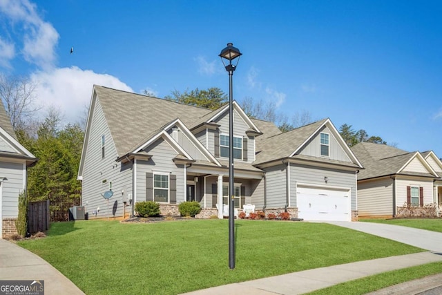 craftsman-style home featuring driveway, a front lawn, board and batten siding, and central air condition unit