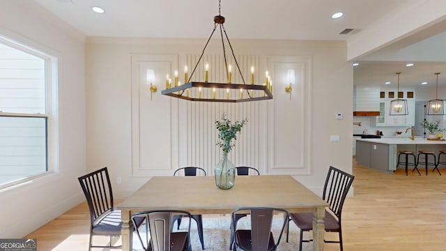 dining room with plenty of natural light, light wood-style flooring, visible vents, and recessed lighting