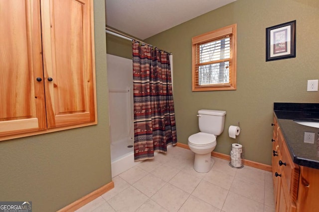 full bath featuring toilet, curtained shower, vanity, and tile patterned floors