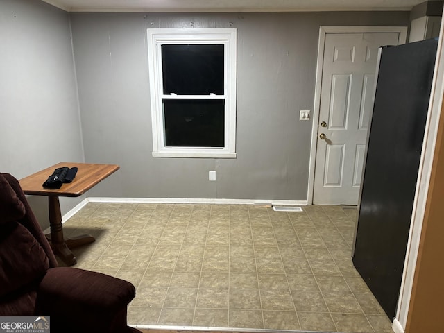 sitting room featuring visible vents and baseboards