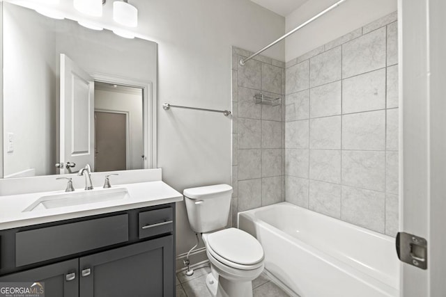 full bathroom featuring tile patterned flooring, bathing tub / shower combination, vanity, and toilet